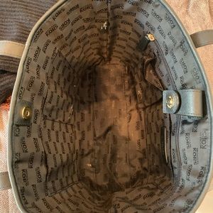 black with gold micro studs down the middle Michael Kors bag